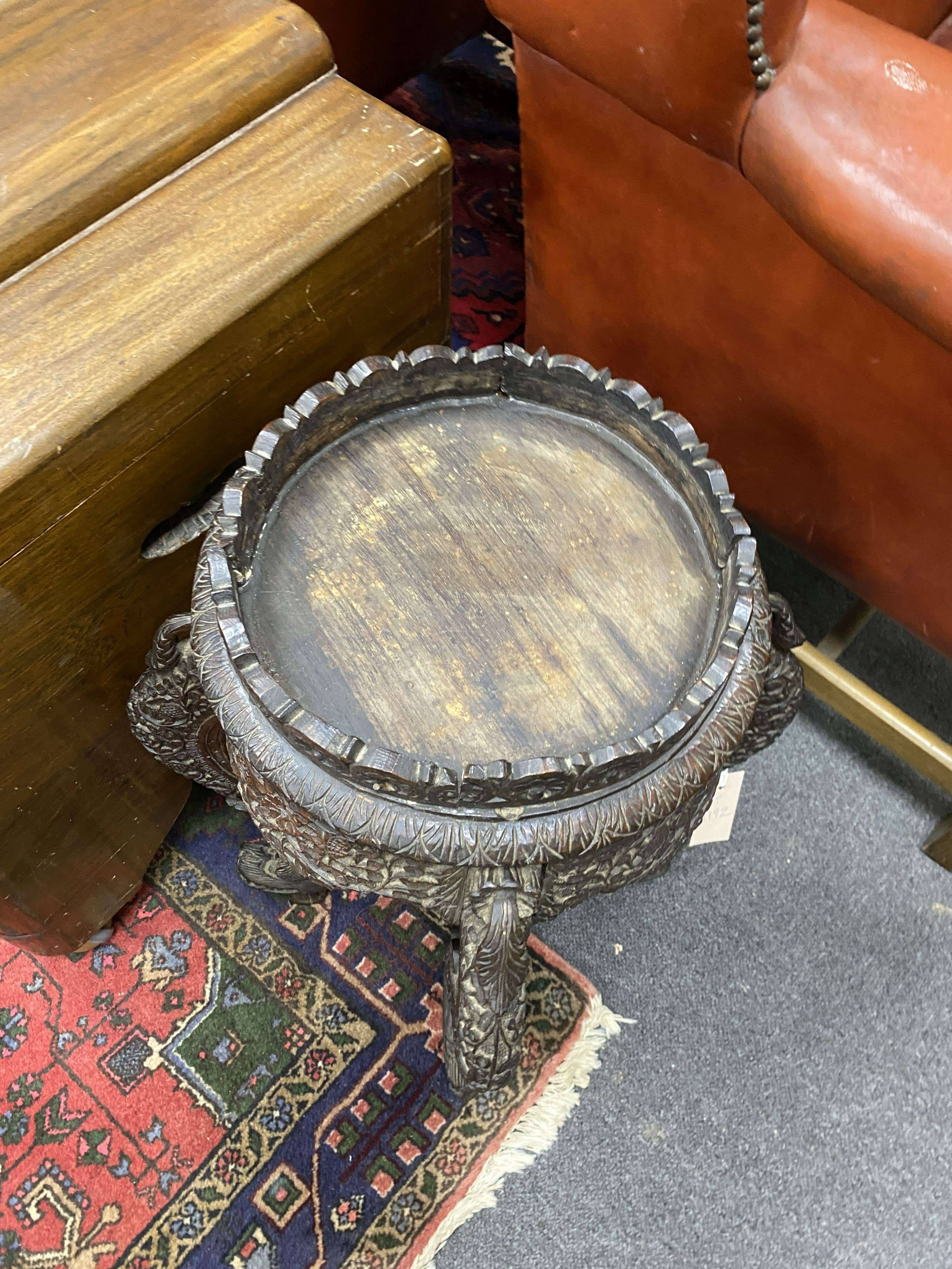 A Burmese carved hardwood jardiniere stand